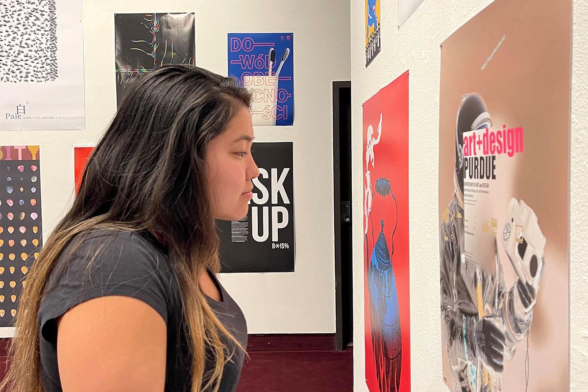 Patron viewing the 2021 poster biennial